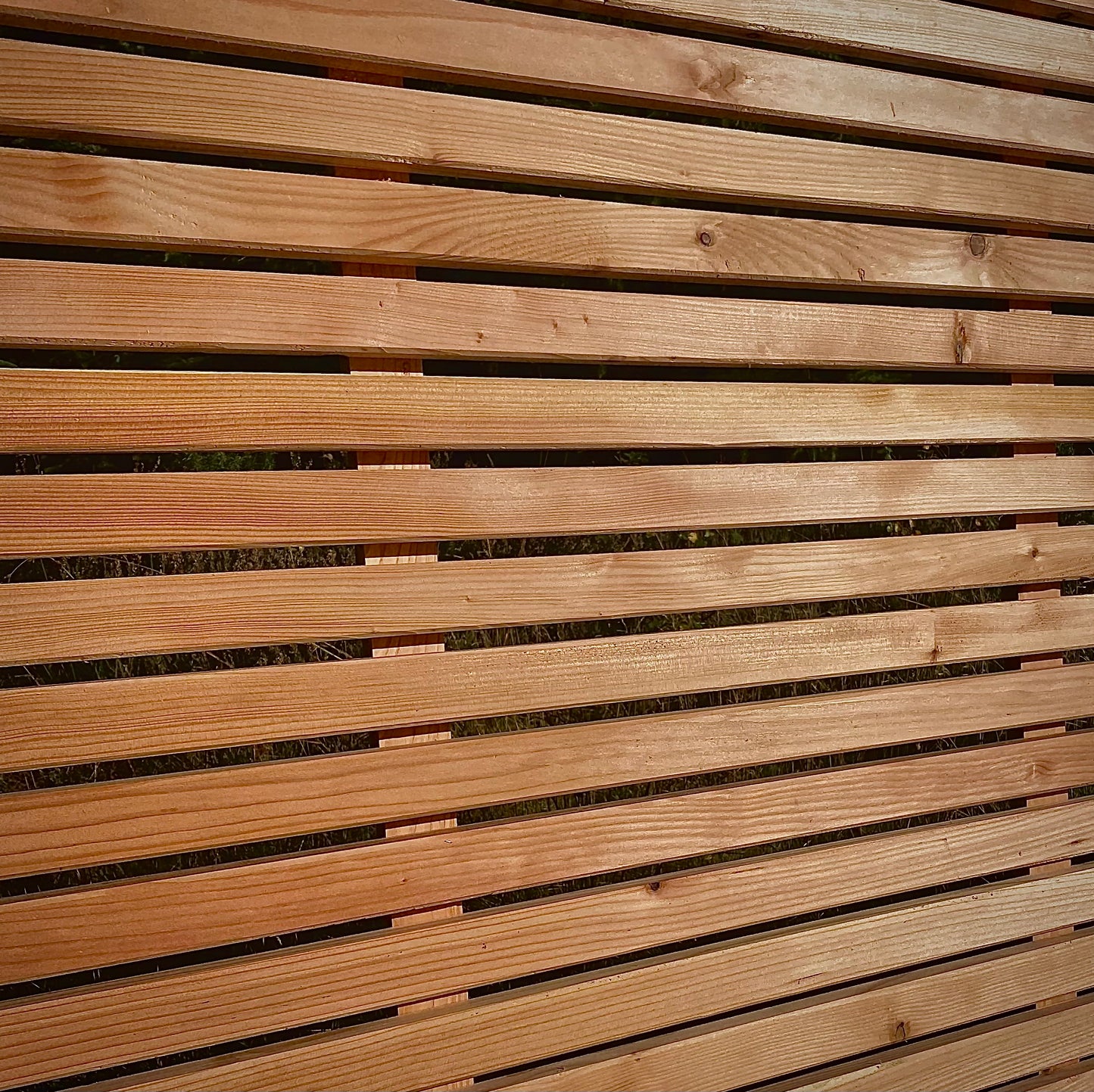 Larch horizontal slatted fence panel